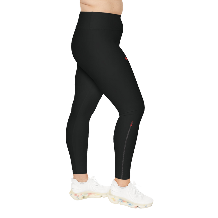 A woman wearing black branded Yoga Women's Workout Plus Size Leggings Gymstar Fitness Clothing. Left side view.
