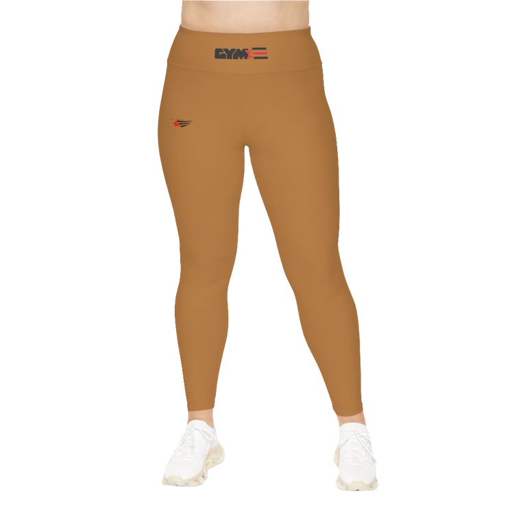 A woman wearing pair of brown high-waisted Gymstar fitness leggings with a logo on the upper left thigh, paired with white sneakers. Front view.