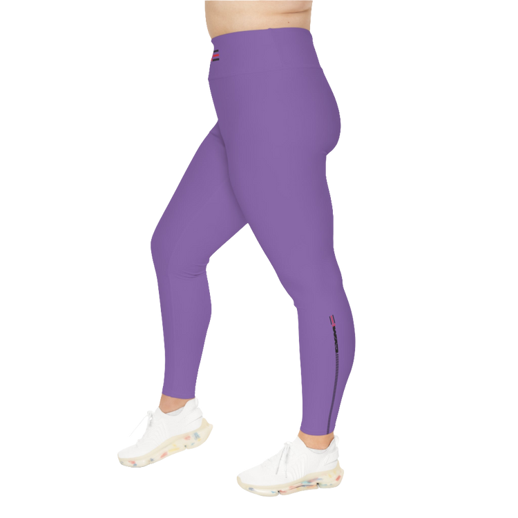 A woman wearing pair of purple high-waisted Gymstar fitness leggings with a logo on the upper left thigh, designed for fitness and yoga. Paired with white sneakers. Right side view.