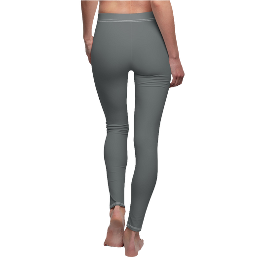 A woman wearing pair of gray fitness leggings for women, featuring a high waist and tagless design. Brandet with a logo Gymstar. Back side view.
