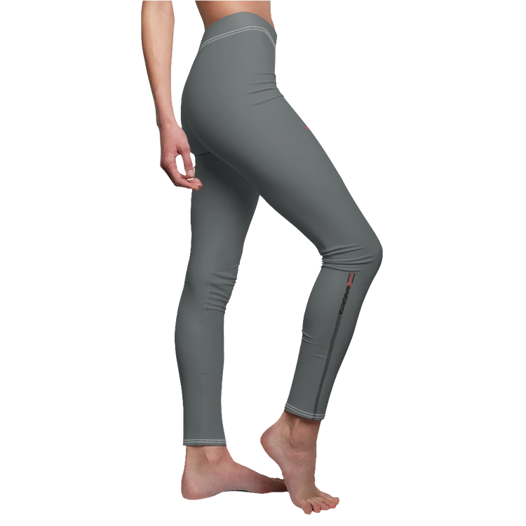 A woman wearing pair of gray fitness leggings for women, featuring a high waist and tagless design. Brandet with a logo Gymstar. Left side  view.
