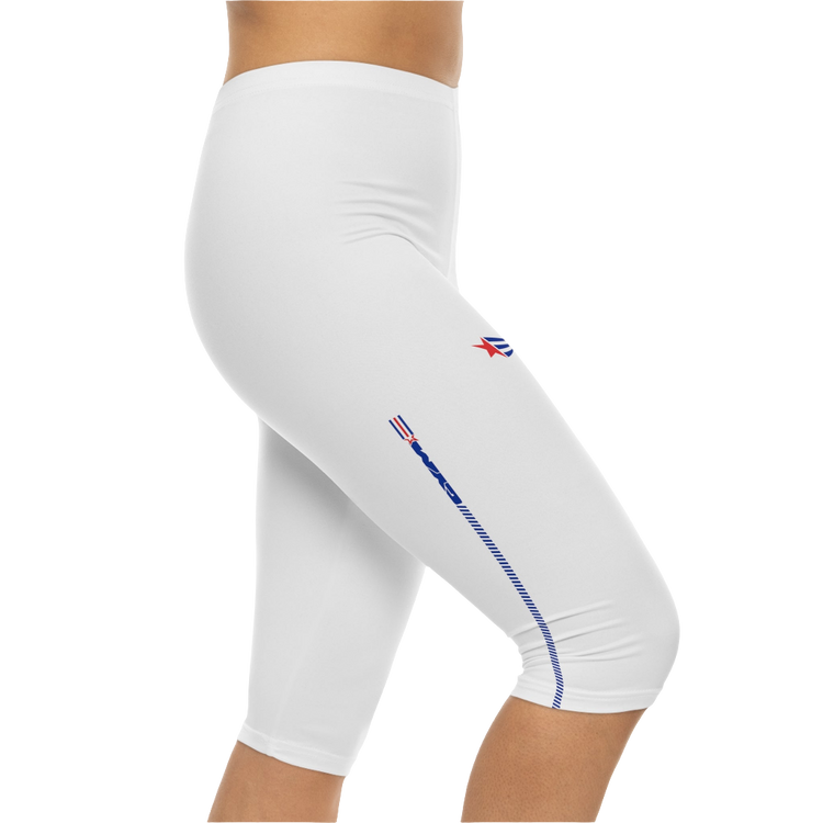 A pair of white Gymstar fitness capri leggings with blue and red detailing on the side, worn by a model, left side view.