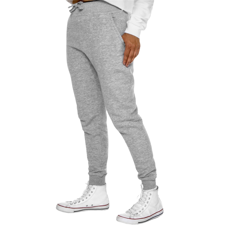 A person standing sideways, wearing silver gray joggers and white sneakers. The joggers have a ribbed bottom and waistband cuffs, and feature two side pockets and a back pocket.