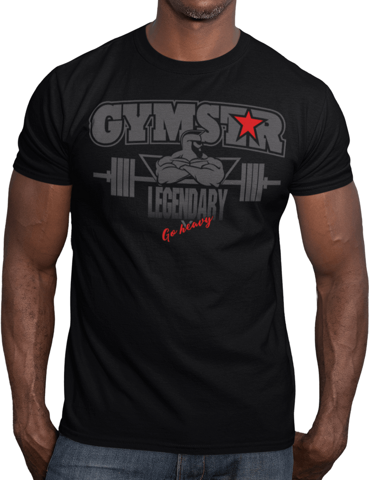 A man wearing black athletic T-shirt GYMSTAR with grey text and graphic on the front reading "LEGENDARY" featuring bodybuilder and barbell illustration, logo above.