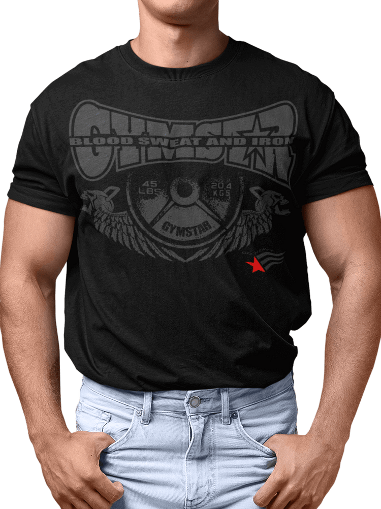 A man wearing a black Gymstar t-shirt with a graphic print that includes text Blood Sweat and Iron, weight lifting barbel and a logo related to fitness and bodybuilding.