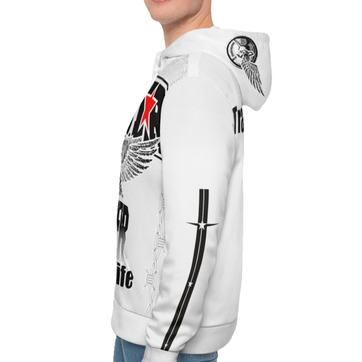 A man wearing a white hoodie with 'GYMSRTA' and related graphics printed on the front, including a star and the text 'ALL WINNERS'. He has a casual and confident expression left cide view.