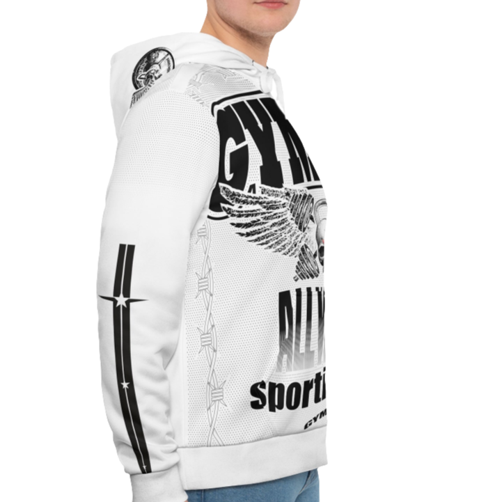 A man wearing a white hoodie with 'GYMSRTA' and related graphics printed on the front, including a star and the text 'ALL WINNERS'. He has a casual and confident expression right cide view.