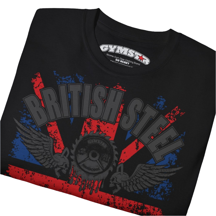 A men's black Gymstar t-shirt featuring a distressed Union Jack flag design. The text "BRITISH STEEL" is arched across the top in blue, with "APOCALYPSTEEL" below it, and "IN THE UK" at the bottom. A stylized circular saw barbel-blade with the words "HARDCORE" is at the center of the design, flanked by two winged, kettlebell-skulls. The overall design has a gritty, bodybuilding aesthetic. Close up view.
