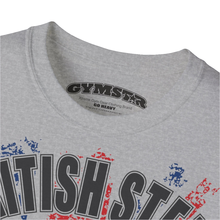 A men's silver grey Gymstar t-shirt featuring a distressed Union Jack flag design. The text "BRITISH STEEL" is arched across the top in blue, with "APOCALYPSTEEL" below it, and "IN THE UK" at the bottom. A stylized circular saw barbel-blade with the words "HARDCORE" is at the center of the design, flanked by two winged, kettlebell-skulls. The overall design has a gritty, bodybuilding aesthetic. Logo Close up view.