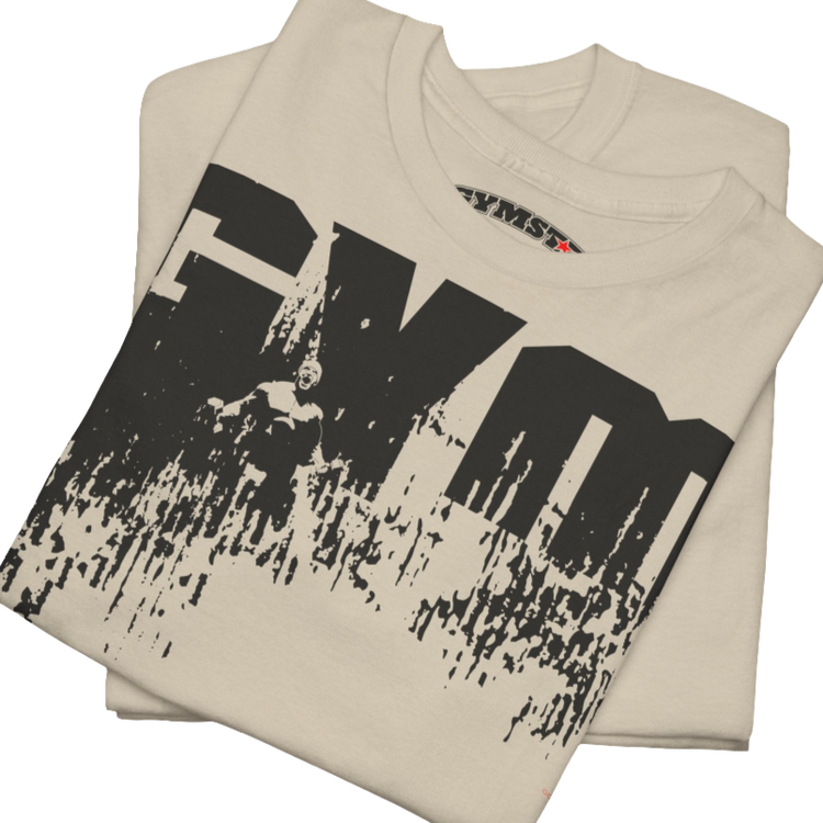 A beige Gymstar workout tee with a black graphic that reads 'GYM',  bodybuilder silhouettte and logo, presumably bodybulding or fitness.  Close up view.