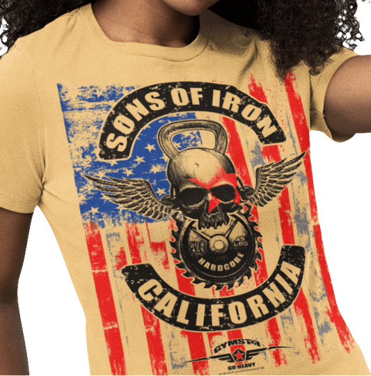 A woman wearing black Gymstar tee with a red, blue and black graphic that reads 'Sons Of Iron', skull-kettlebell, barbell and logo, presumably bodybulding or fitness.