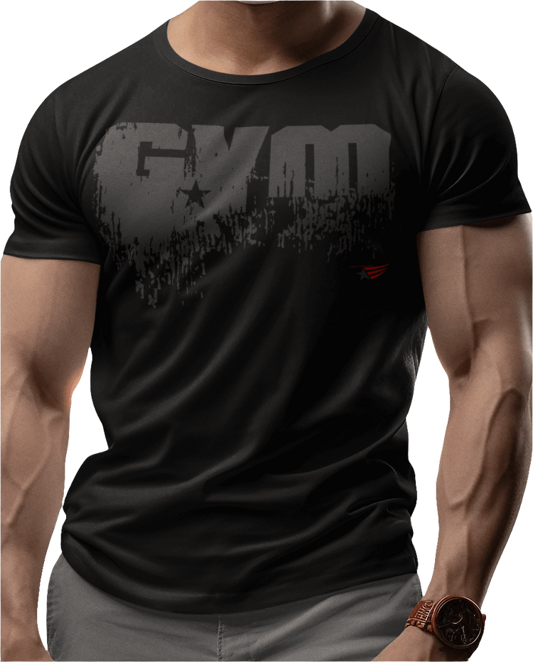 A man wearing black sports t-shirt from Gymstar with a minimalist yet powerful design. The chest features a large, distressed print of the word "GYM" in grey. The design is complemented by a small brand logo with a red star, which adds a stylish accent. The t-shirt is perfect for athletic wear, creating a modern and clean look.