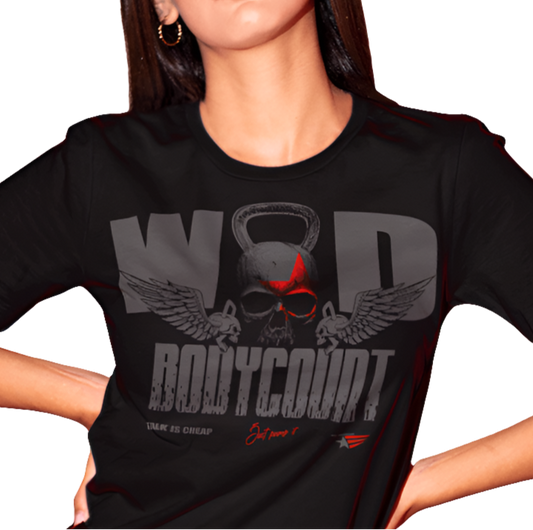 A woman wearing black Gymstar t-shirt, perfect for intense workouts. Made in dark grey with a massive chest print that combines elements like a skull in a kettlebell, spread wings, and a red star. The design is completed with motivational texts "WOD Bodycount", making it an ideal choice for any athlete.