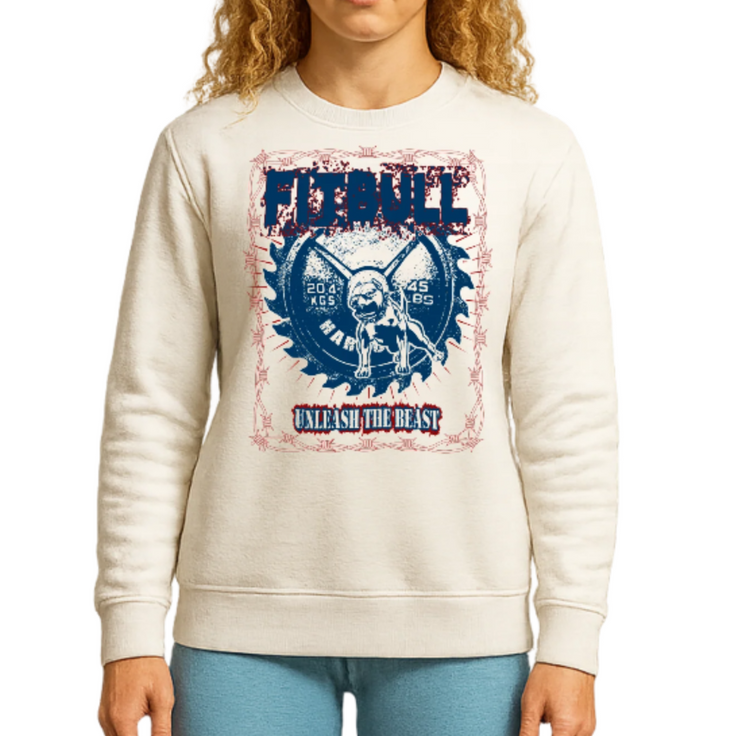 A young woman wearing a cream sweatshirt Fitbull with  Unleash the Beast motivating,
 graphic design.