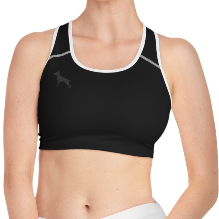 young woman posing for a photo with a black-white fitness bra from Fitbull fit wear