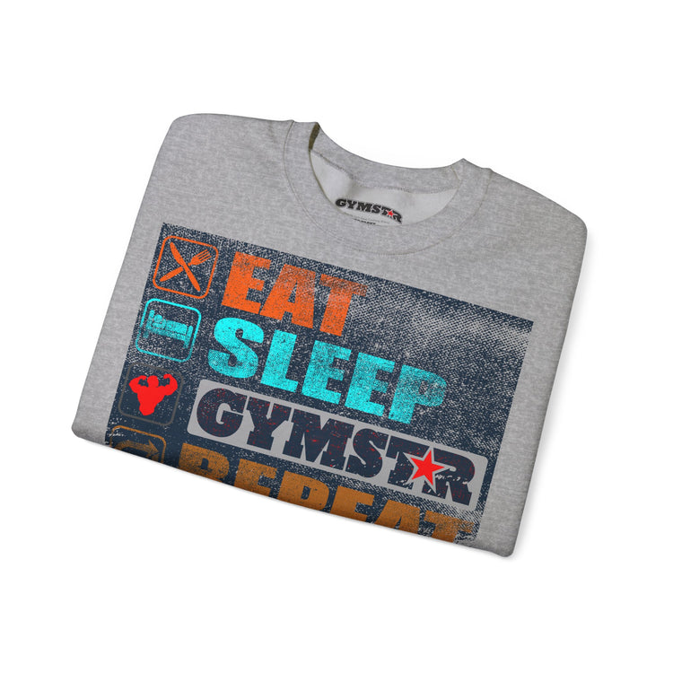 A folded heather gray t-shirt with a distressed graphic print that reads 'EAT SLEEP GYMSTAR' in orange, teal, and white, with a gym star logo. The brand name 'GYMSTAR' is visible on the inner neck label.