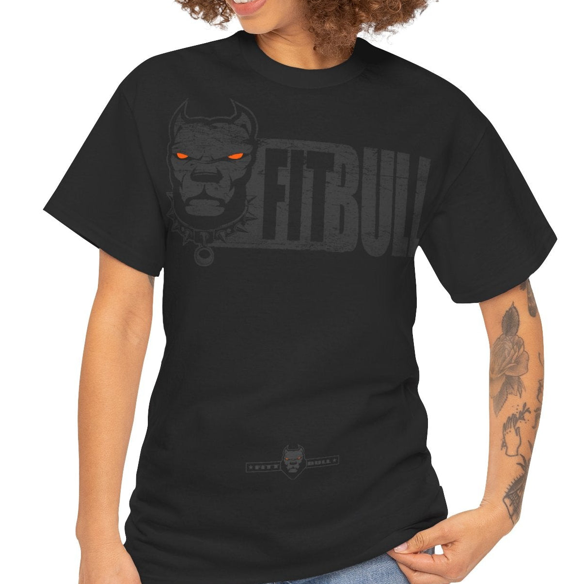 Woman wearing a black t-shirt Fitbull with a white cross design on a white background