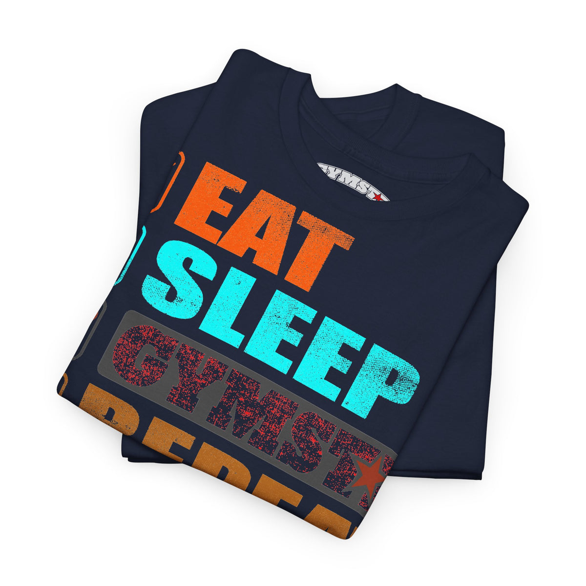 A folded navy blue t-shirt with a colorful graphic print reading 'EAT SLEEP CYMBAL REBEL' in orange, cyan, and red distressed lettering, shown on a white background.