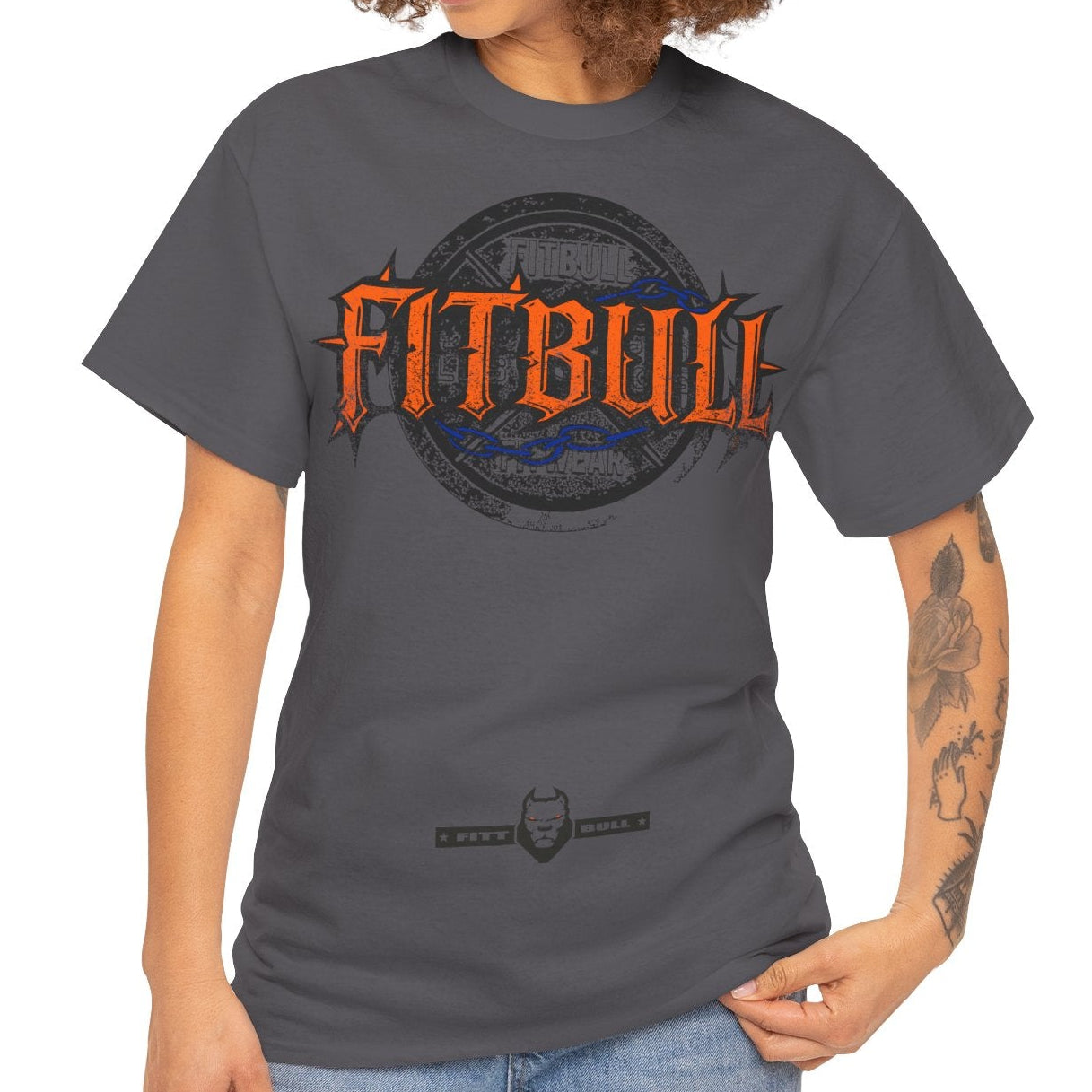Woman wearing a gray t-shirt with 'FITBULL' text on a white background