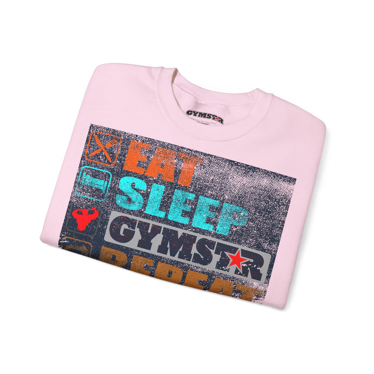 A folded light pink crewneck sweatshirt with a distressed graphic on the front reading 'EAT SLEEP GYMSTAR' in orange, teal, and white, with a gym star logo. The inner collar shows the brand name 'GYMSTAR'.