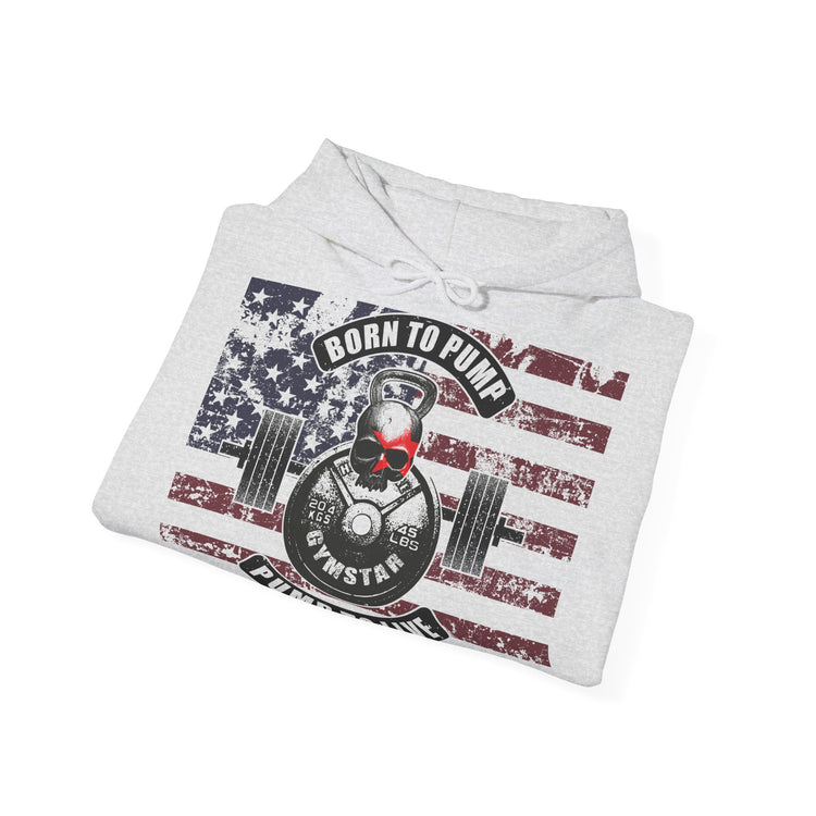 A light heather gray hoodie folded flat, featuring a distressed American flag graphic with a central kettlebell and barbell design, the words 'BORN TO PUMP' and 'FUELSTAR', and a small red heart on the flag.