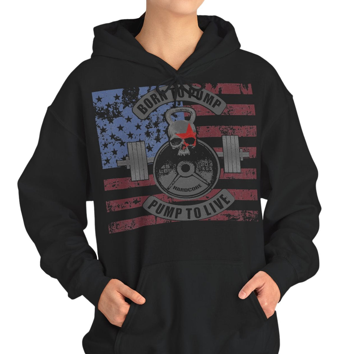 A woman modeling a black pullover hoodie with a distressed American flag graphic on the chest featuring a weight plate and the text 'ROCK YOURSELF PUMP TO LIFE'.