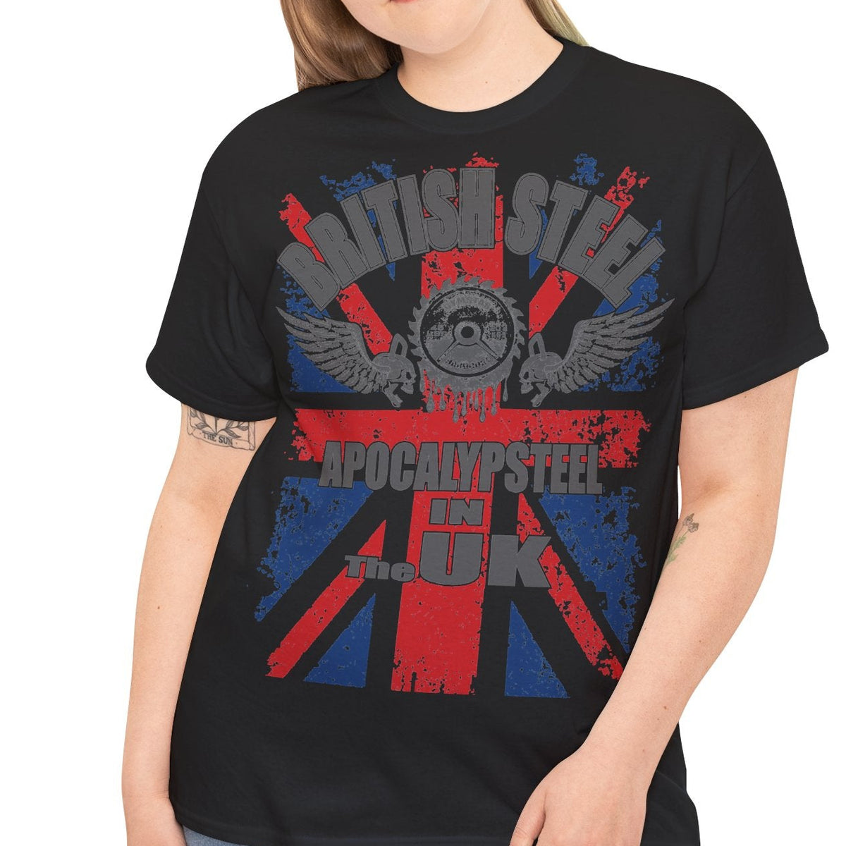 Person wearing a black t-shirt with a graphic design on a white background