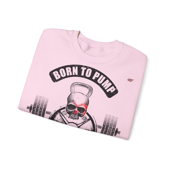 A light pink crewneck sweatshirt with a graphic of a skull lifting a kettlebell and barbell, under a black banner that reads 'BORN TO PUMP'.