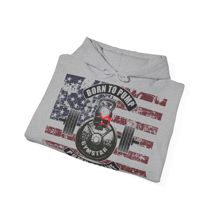 A folded light gray heather hoodie on a white background, featuring a distressed American flag graphic with a skull wearing red sunglasses and a barbell, with the text 'BORN TO PUMP' and 'FIT AS A STAR'.