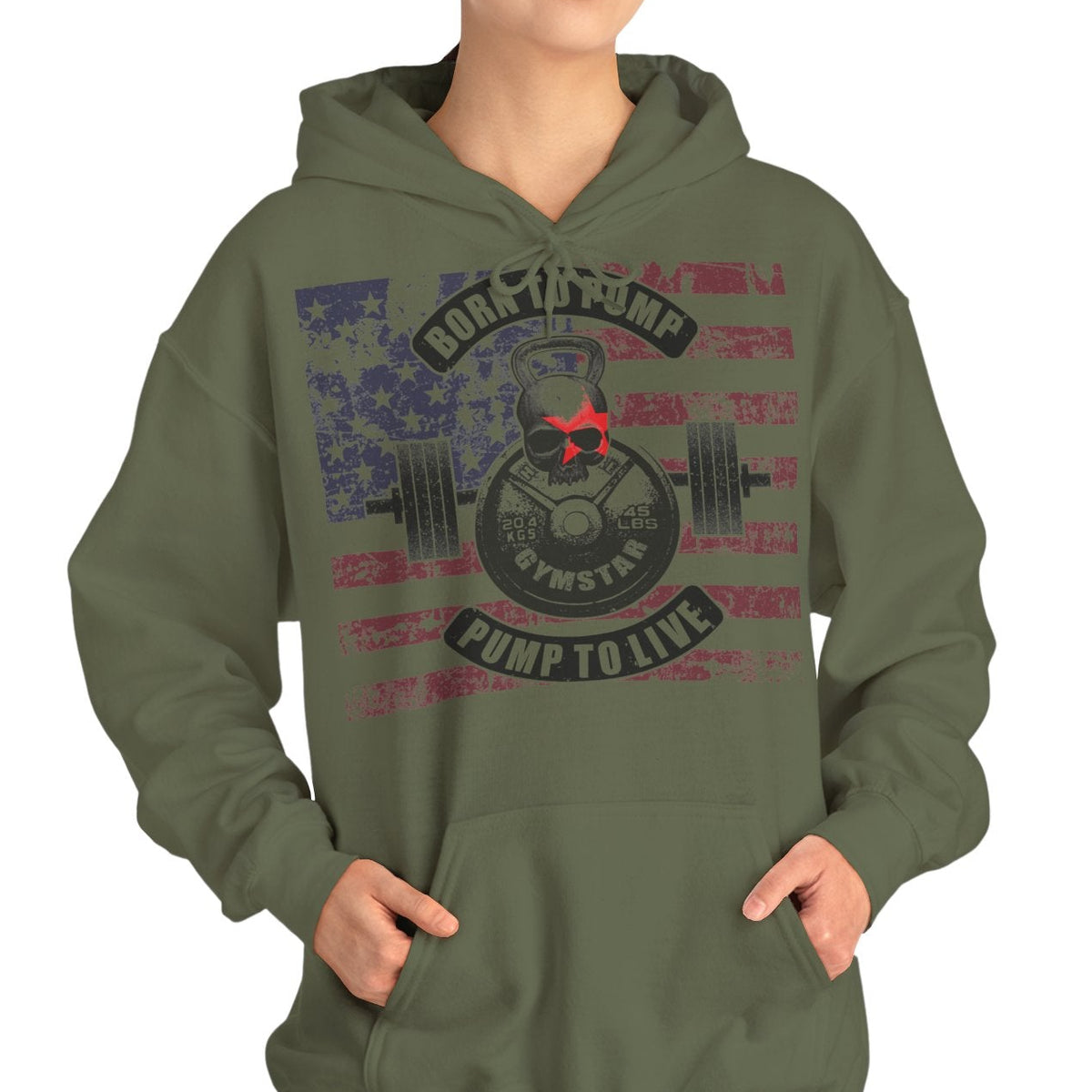 A woman modeling an olive green pullover hoodie with a distressed patriotic graphic on the front featuring a weight plate, barbell, and the words 'Rock the Pump' and 'Pump to Live'.
