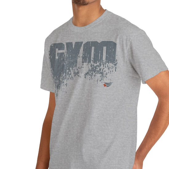 A man wearing a heather gray t-shirt with black text that reads 'GROW YOURSELF BY GROWING YOUR OWN' paired with blue jeans, set against a plain white background.