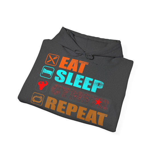 A dark gray folded hoodie on a white background, featuring a colorful graphic print that reads 'EAT SLEEP GYMSTAR REPEAT' with small food and activity icons in orange, turquoise, and red.