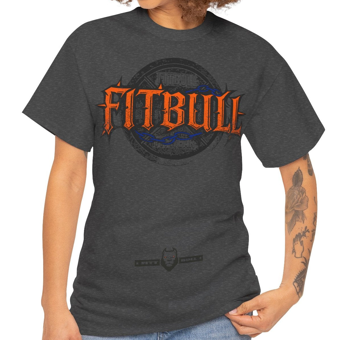 Woman wearing a dark gray t-shirt with a FITBULL graphic design on a white background