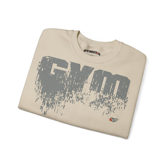 A folded beige crewneck t-shirt with a large distressed dark gray 'GYM' graphic on the front, a small red and black logo on the lower right chest, and a visible 'GYMSTAR' brand print inside the collar.