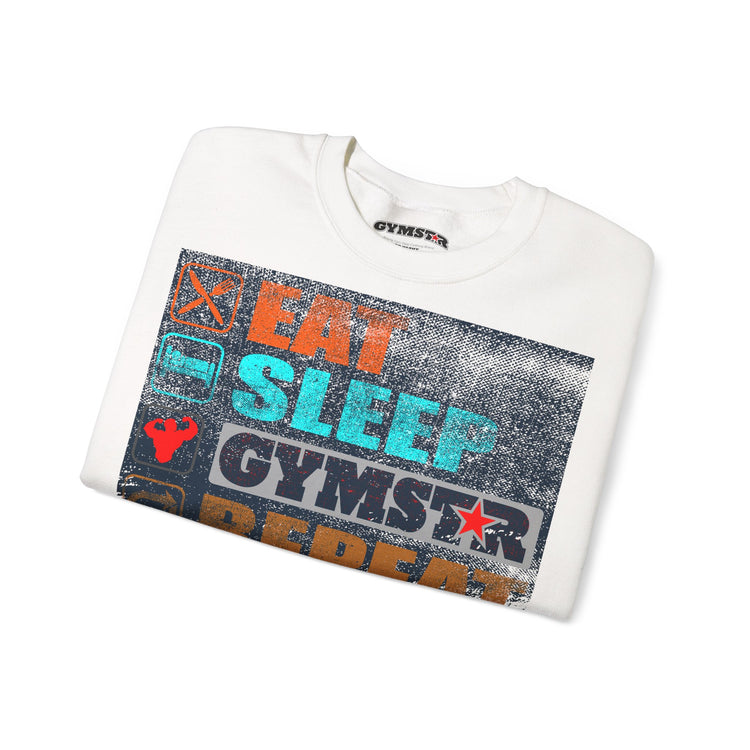 A folded white crewneck sweatshirt with a large distressed graphic on the front. The graphic features the text 'EAT SLEEP GYMSTAR' in orange, teal, and white, along with a red star and other gym-themed icons on a dark textured background.
