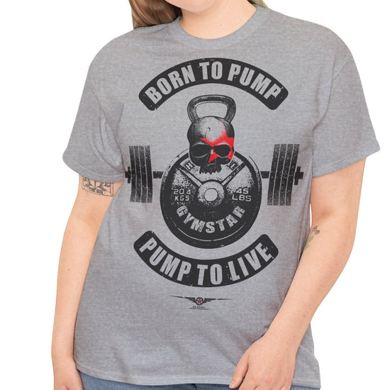 A woman modeling a heather gray t-shirt with a black and red graphic design featuring a kettlebell, barbell, and the text 'BORN TO PUMP PUMP TO LIVE' and 'GYMSTAR'.