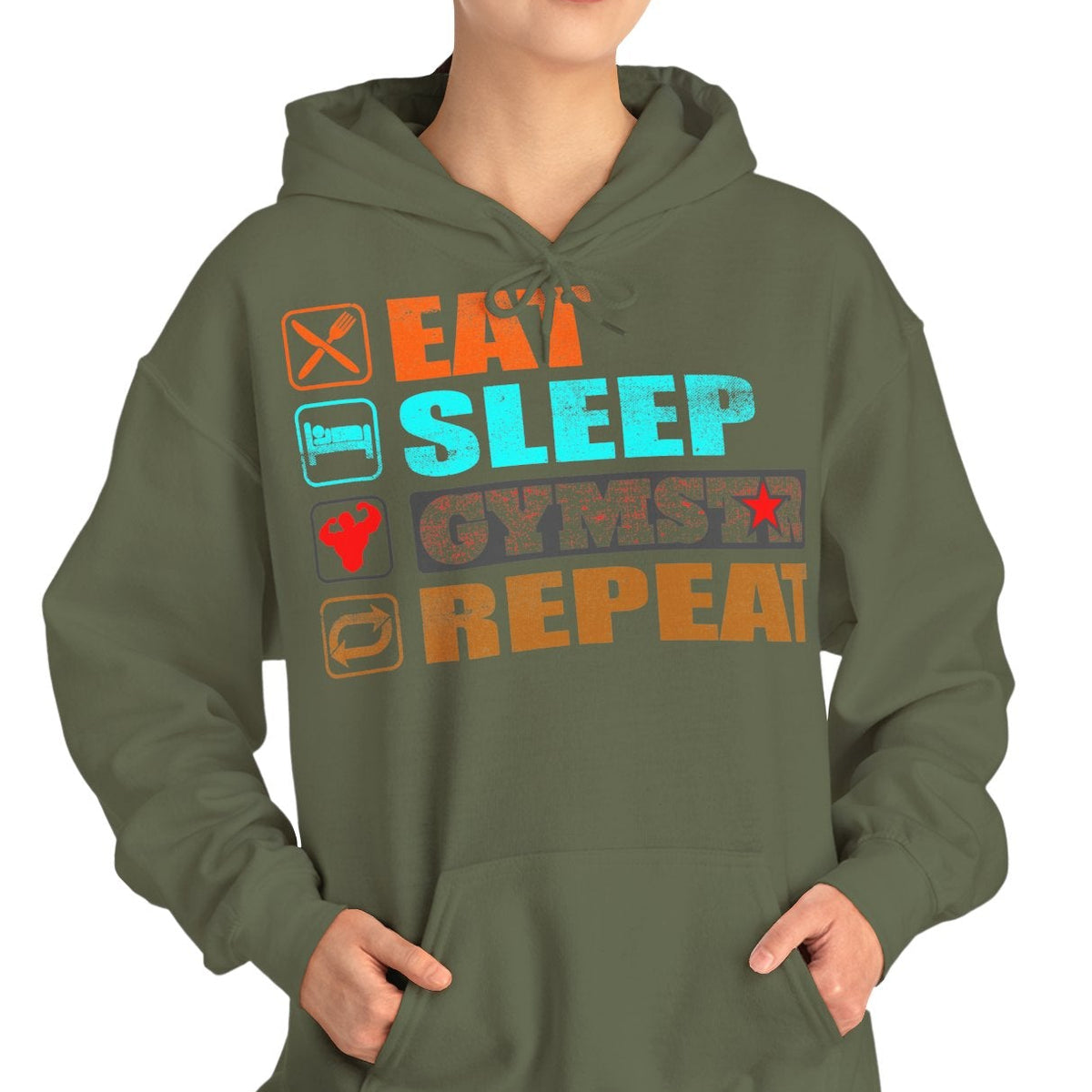 A woman modeling an olive green hoodie with a colorful graphic text design that reads 'EAT SLEEP GYMSTAR REPEAT' in orange, blue, and gray block letters, set against a plain white background.