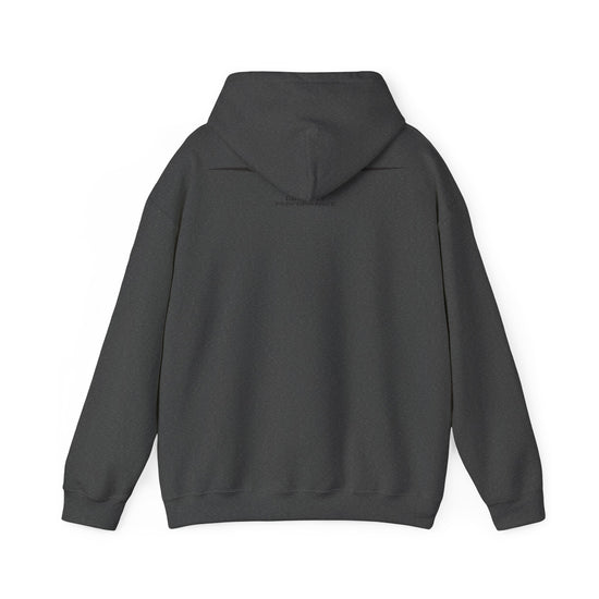 A dark green hoodie shown from the back, featuring a large graphic print of a skull surrounded by green leaves, with the word 'MONSTERA' in a stylized beige font above it. The hoodie is displayed against a light gray background with subtle paper texture and paint splatter details.
