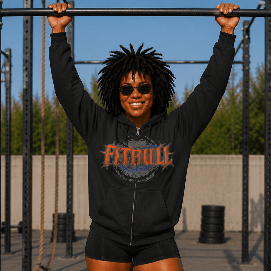 Person wearing a black hoodie with 'Fitbull' logo, doing pull-ups outdoors.