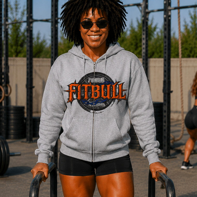 Person wearing a Fitbull hoodie at an outdoor fitness facility.