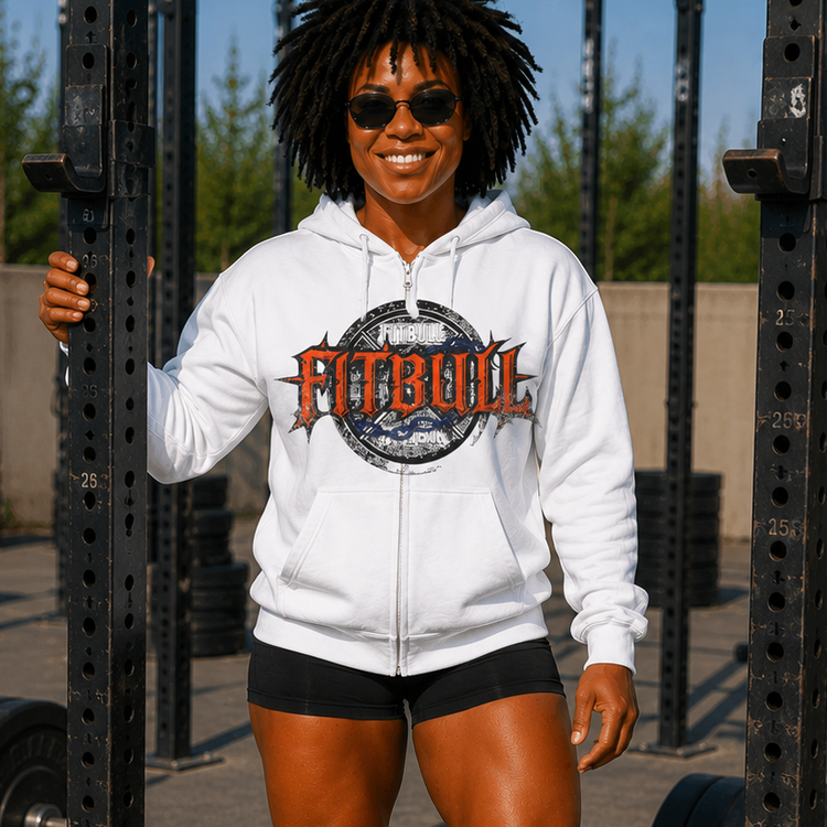 Person wearing a white hoodie with 'Fitbull' logo in an outdoor gym setting