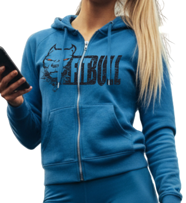 Woman in blue Fitbull fitness athletic wear holding a phone and dumbbell in a gym.