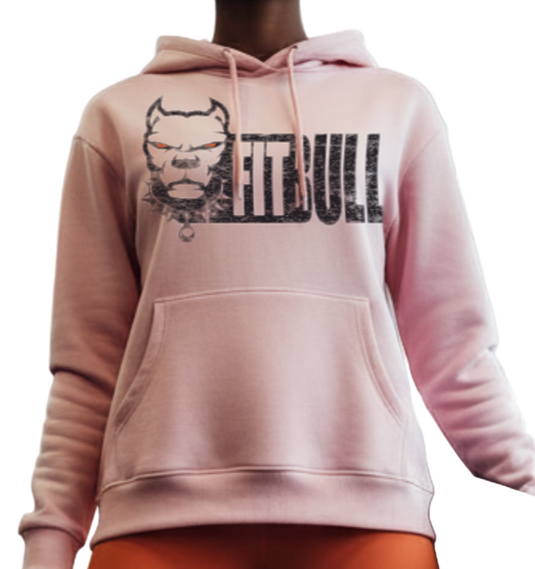 Person wearing a pink Fitbull hoodie and orange leggings in a gym setting