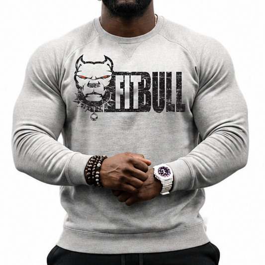 Man wearing a gray Fitbull sweatshirt with a logo and text, black pants, and colorful sneakers on a white background