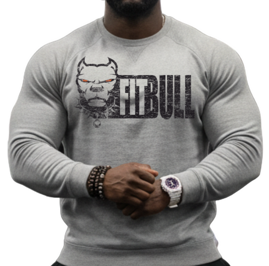 Man wearing a FitBull fitness sweatshirt in a gym setting