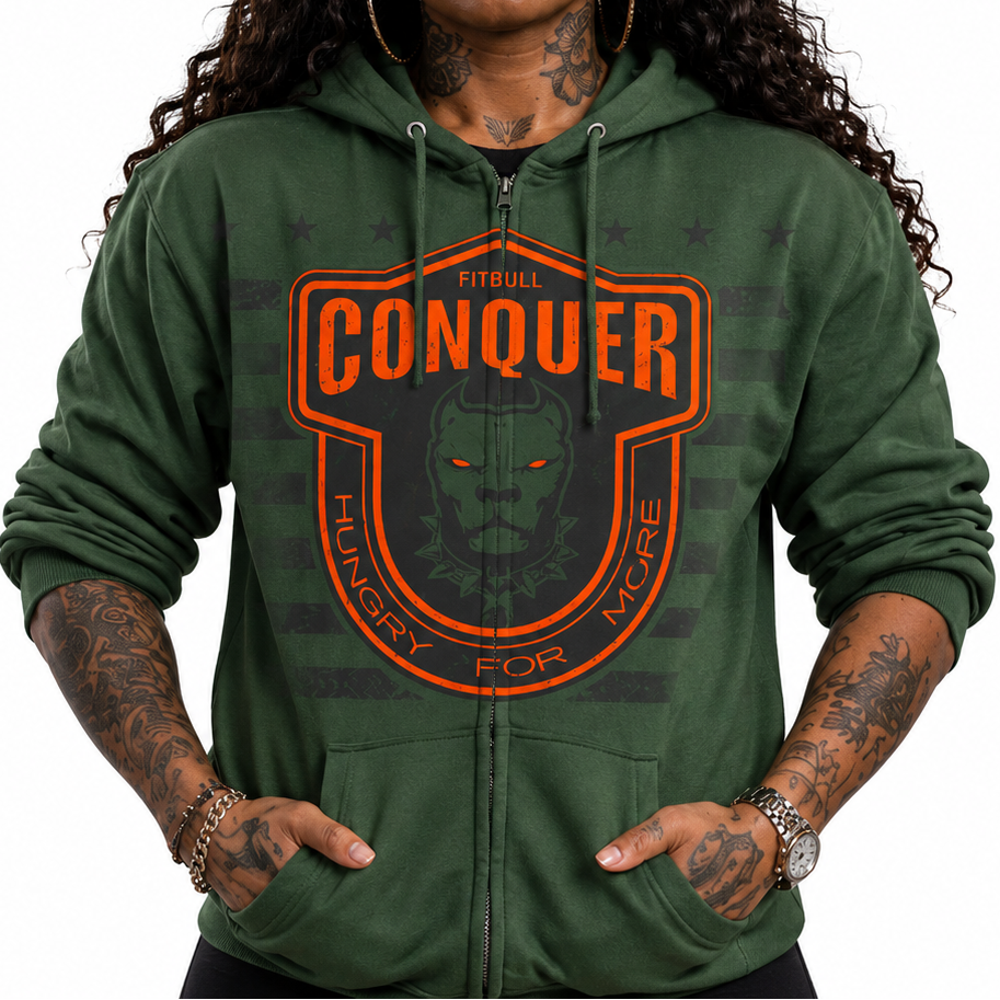 Person wearing a green Fitbull hoodie with 'Conquer' logo and text, black cap with logo.