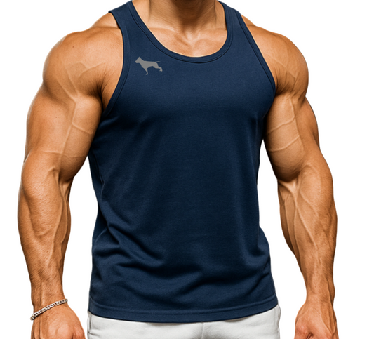 Muscular man in a gym wearing a sport navy blue Fitbull tank top and white shorts, holding kettlebells.