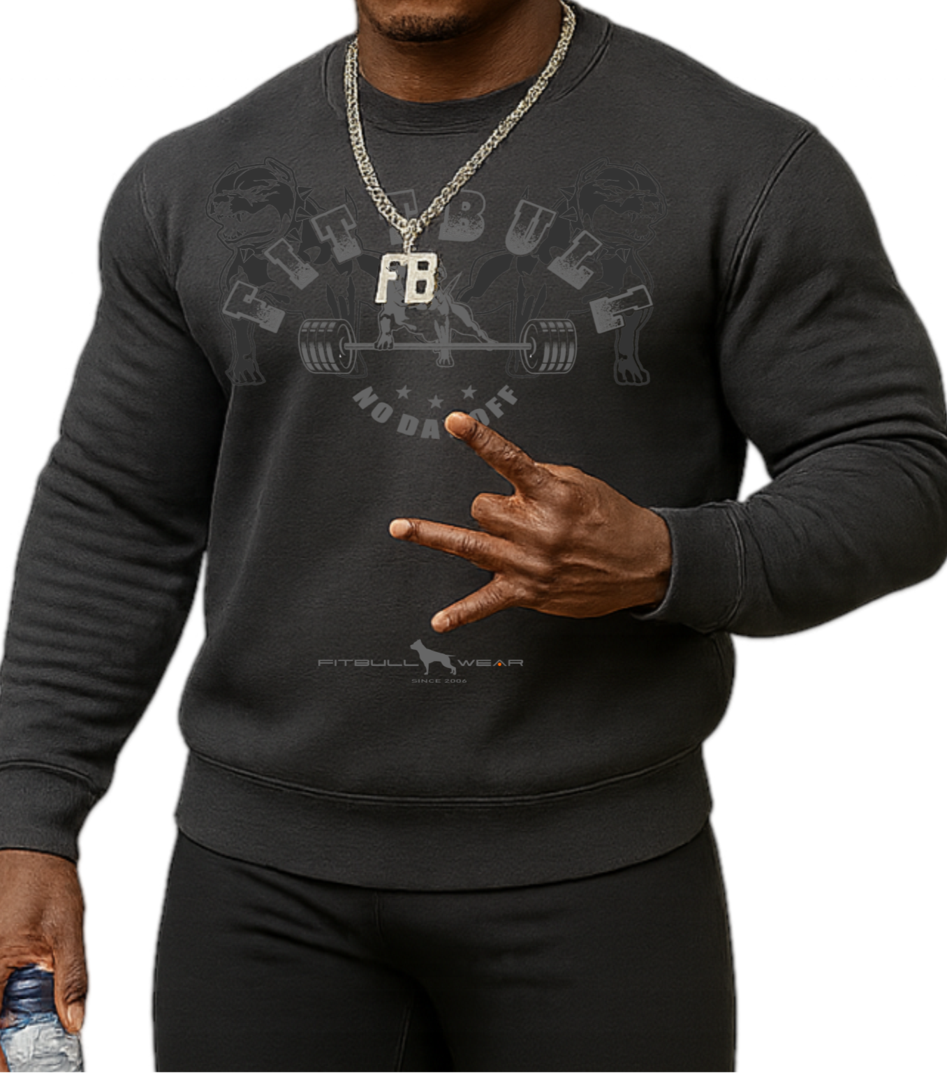 Man wearing a black, sports sweatshirt, hat and pants Fitbull, holding a water bottle 