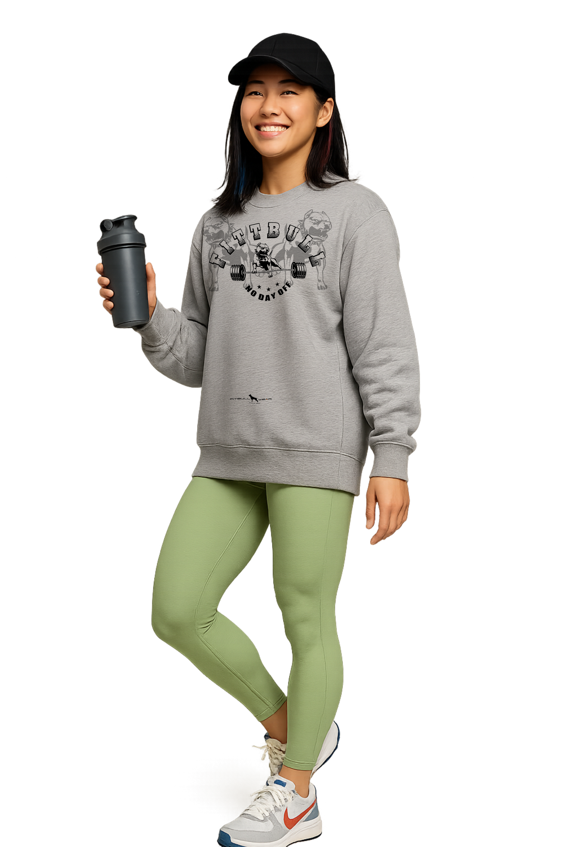 Woman in athletic Fitbull sweatshirt wear holding a shaker bottle.