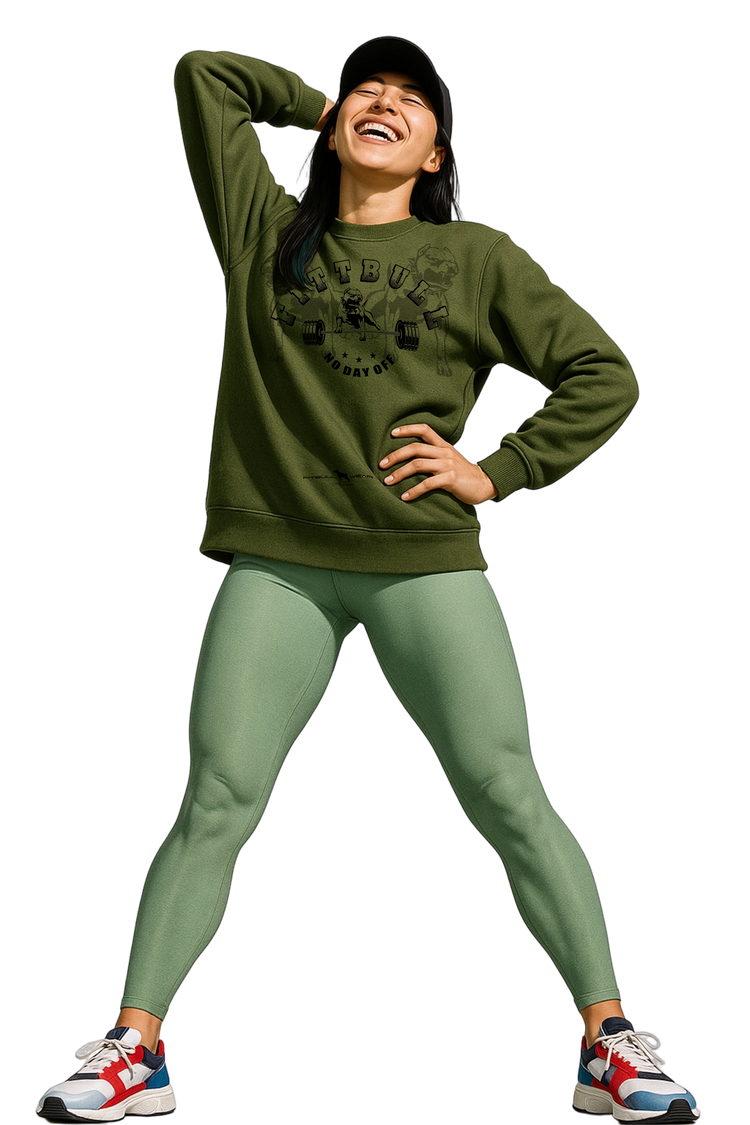 A woman wearing a green Fitbull fitness sweatshirt and leggings with a white background